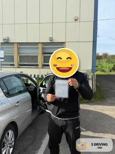 5 Driving School pupil holding their driving test pass certificate