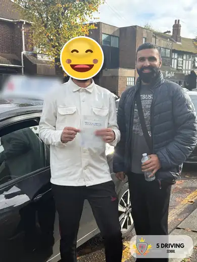 5 Driving School pupil holding their driving test pass certificate